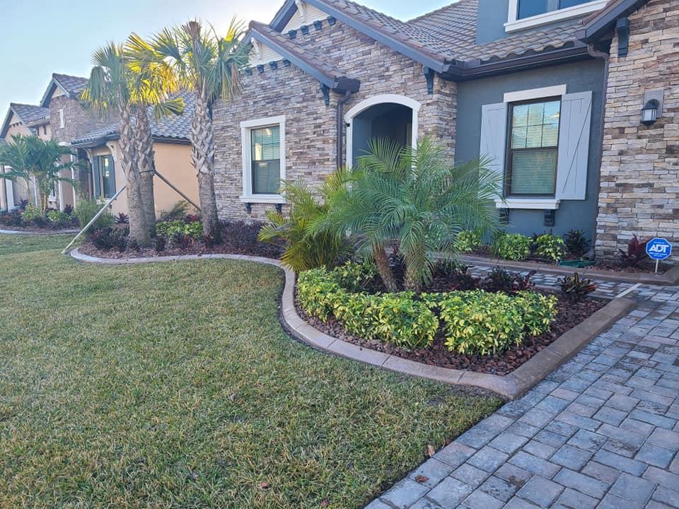 Retaining wall and step construction for a multi-level residential landscape, Tampa FL